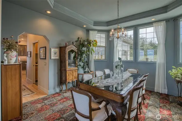 Dining room with hallway leading to the kitchen and laundry room.