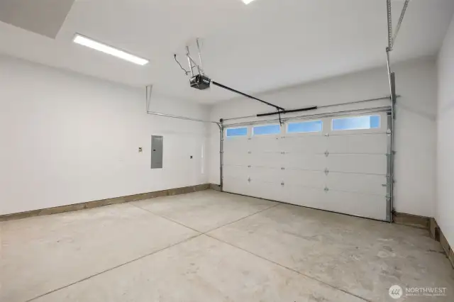 Generous 2 Car Garage w/ Electric Charger Outlet.