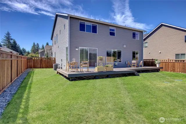 Generous fully fenced backyard with gates on both sides of the home