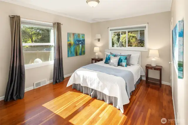 Wake up with sunshine in this bright and airy bedroom.