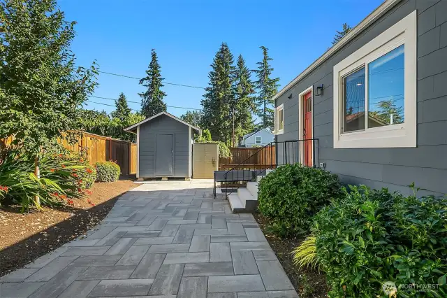 Entertain or unwind on the expansive patio. Sheds offer great storage for tools, bikes, or gear.