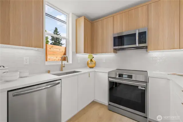 Large kitchen with island, ample storage, and tons of counter space