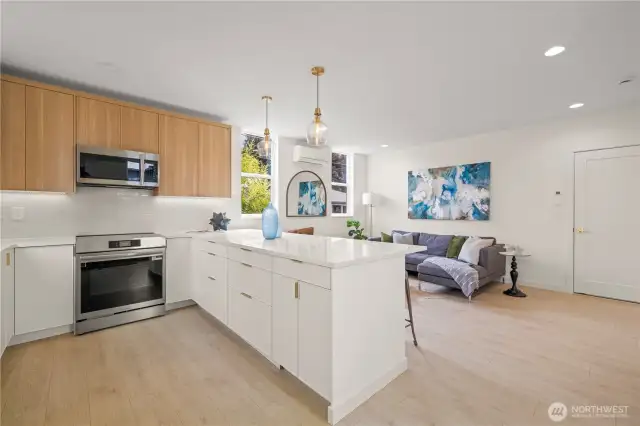 Large kitchen with island, ample storage, and tons of counter space