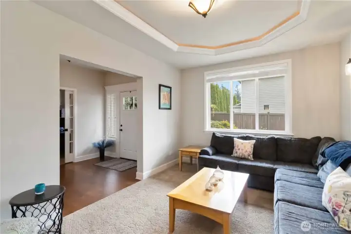 Natural light pours into this cozy sitting space, creating the perfect spot to relax