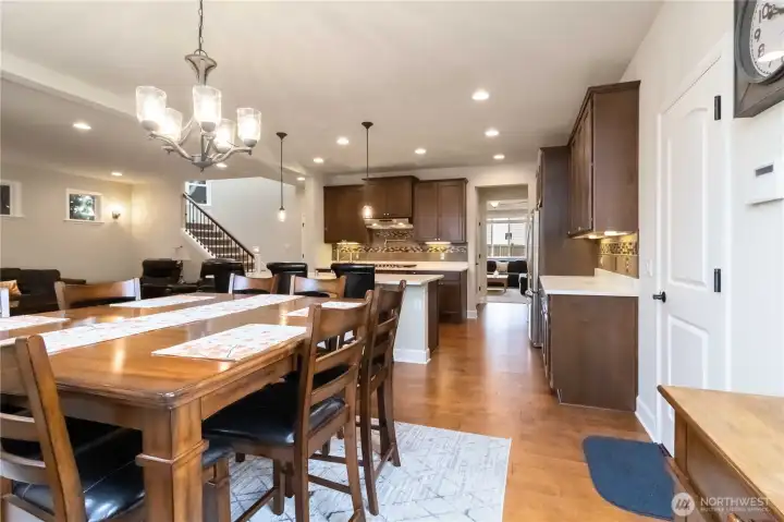 Large dining area with open sightlines to the kitchen and living room.