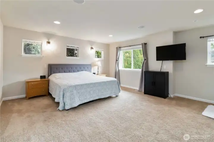 Retreat to this expansive primary suite designed for relaxation and comfort.
