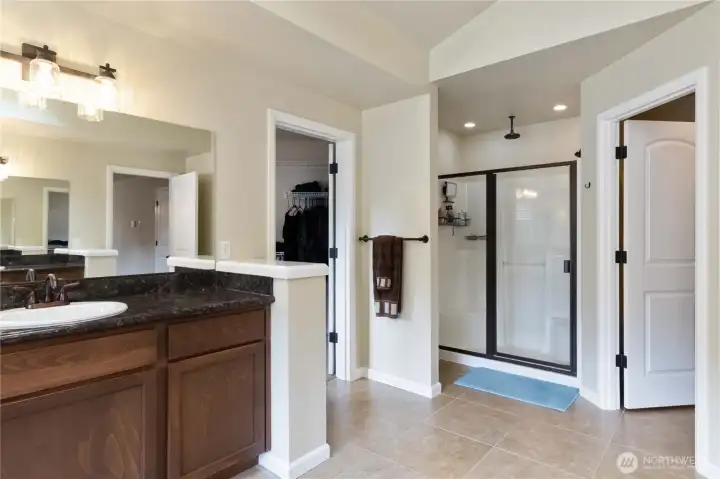 Spacious glass-enclosed walk-in shower offering style and relaxation.