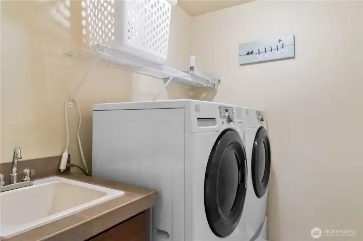 Upper-level laundry room adds convenience and functionality.
