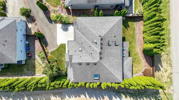 Beautiful aerial perspective of the property, featuring lush greenery and private outdoor spaces.