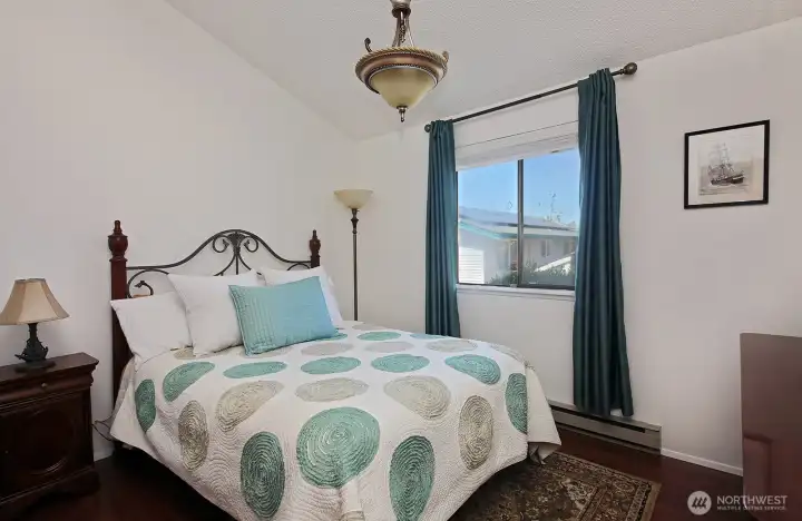 Bedroom with vaulted ceiling.