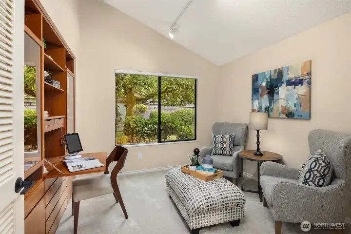 The first bedroom features double doors and a closet customized with a built-in desk and storage—easily removable to return the space to a traditional bedroom.