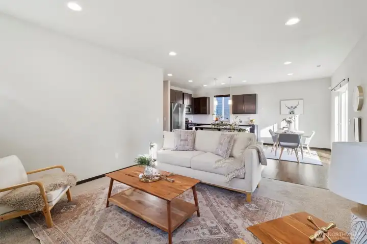 Open concept living, kitchen, dining.