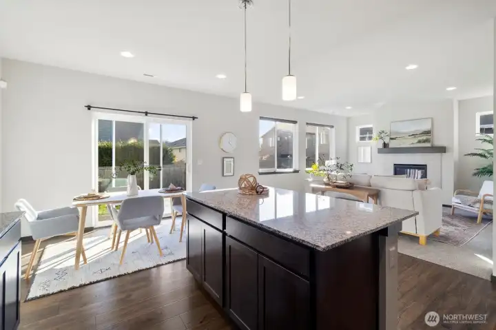 Open concept living, kitchen, dining.