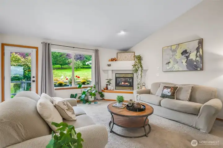 Family room with views and a door to the patio and gardens.
