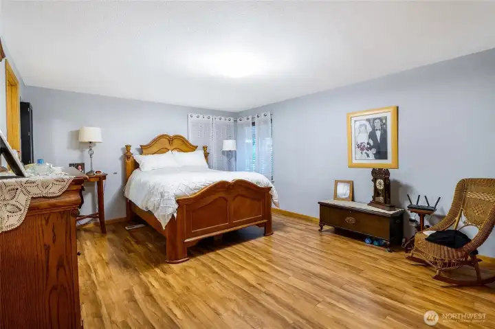 Spacious primary suite with golf course views