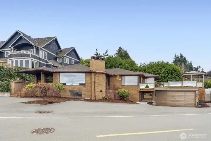 Front of Property with Large Windows, Deck Space Over Garage, w/ RV Parking