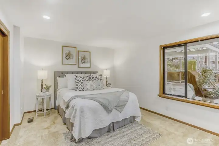 Primary Bedroom w/ 180* Unobstructed View of Sound & Olympics and Over Garage Deck area