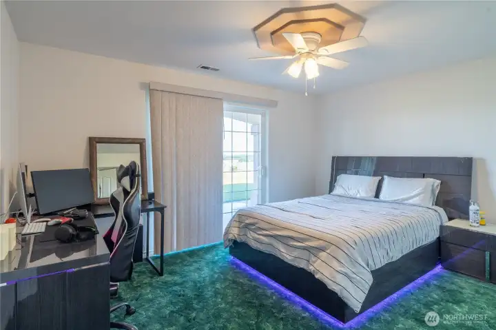 lower level bedroom (1 of 3) with slider to outside patio