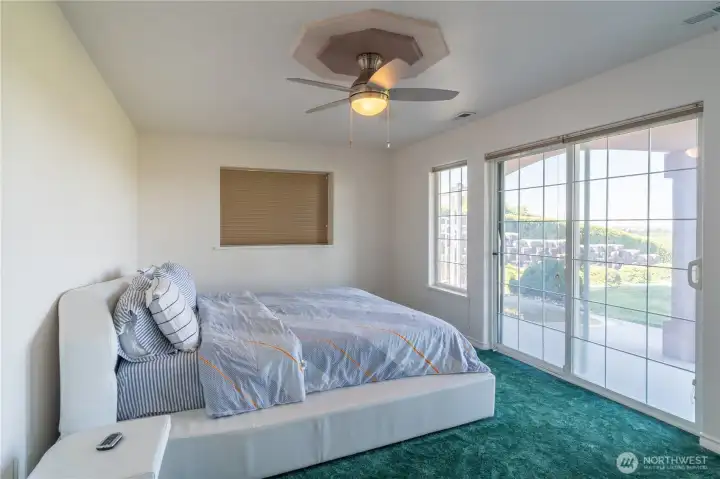 lower level bedroom (2 of 3) with slider to back patio