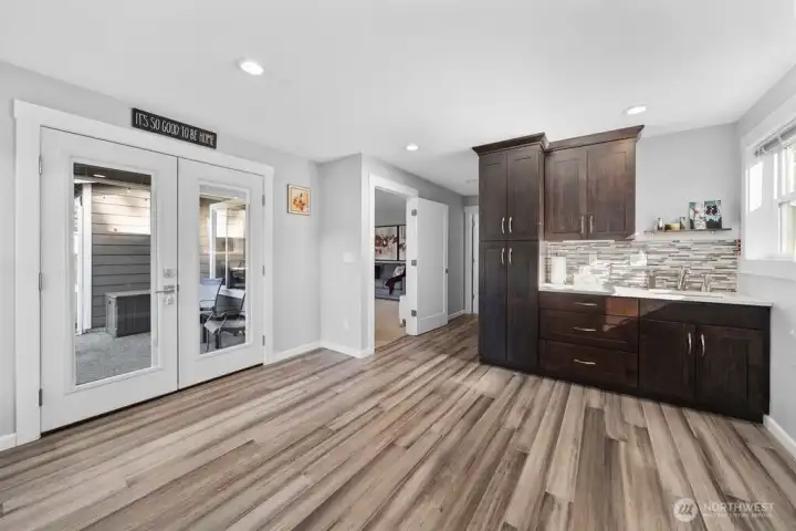 Multi-Gen Living Room Open To Wet Bar