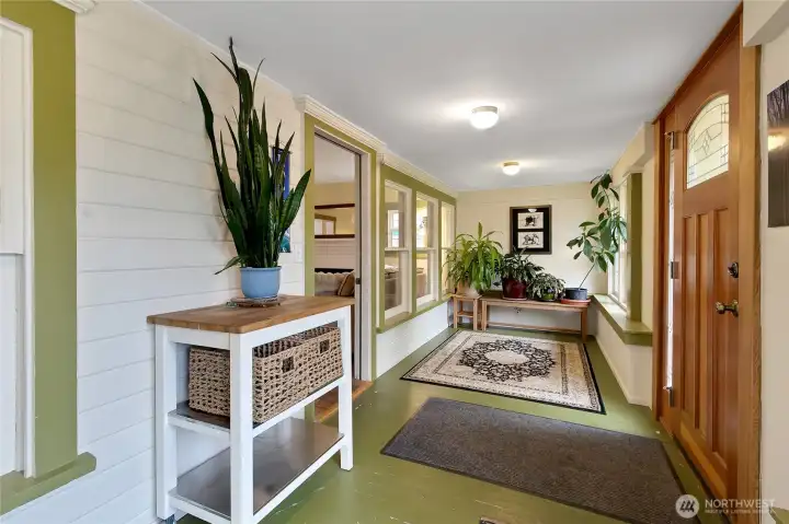 HUGE mudroom with so many windows.