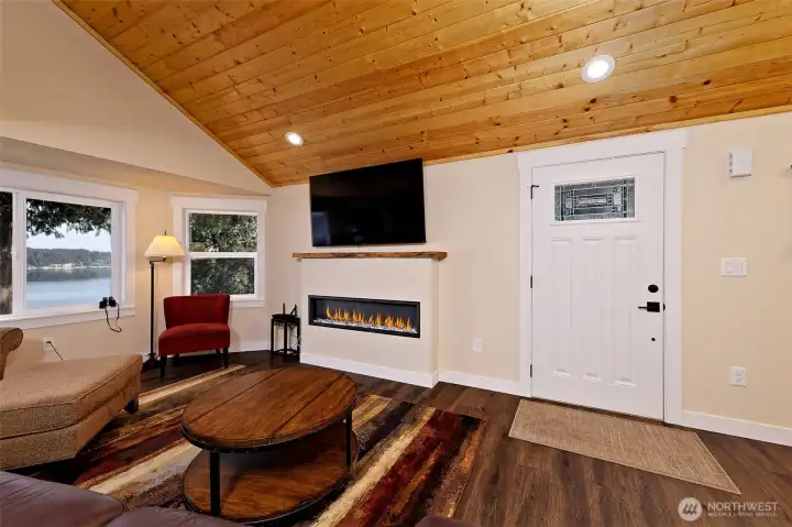Entry to great room style layout with fireplace.