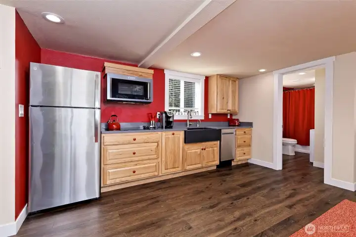 Kitchen and main level full bath with laundry included.