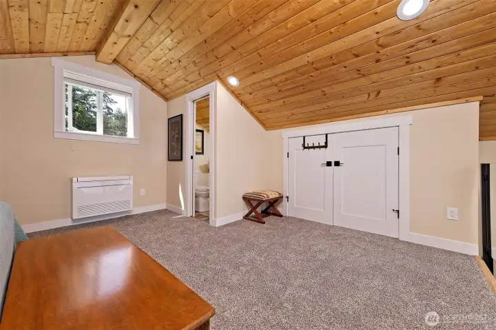 View of closet and half bath in loft bedroom.