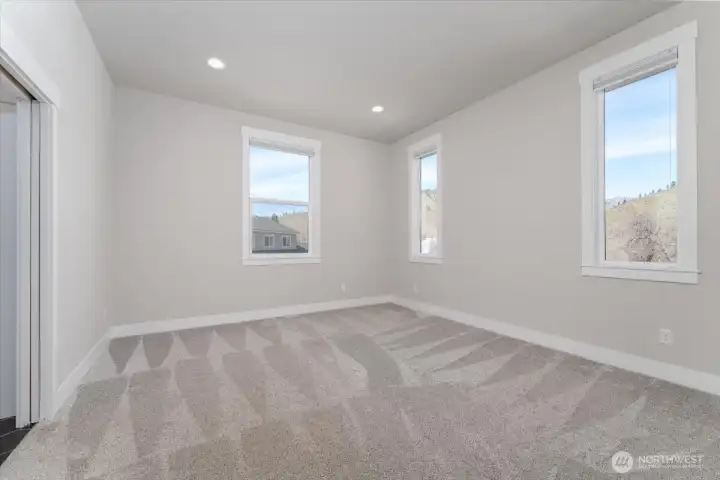 Primary bedroom is bright with natural light.