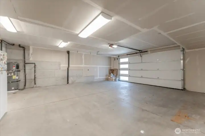 28' deep garage with extra room for work space or storage. Garage has 2 electric car chargers.