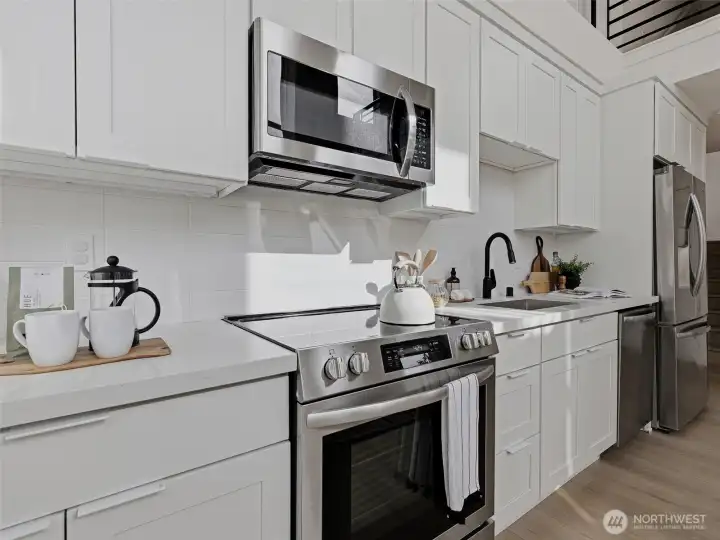 Kitchen with quartz countertops and stainless steel appliances
