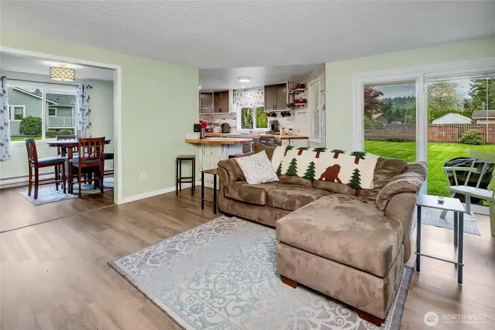 Looking from the entry into the family room, kitchen, and dining room