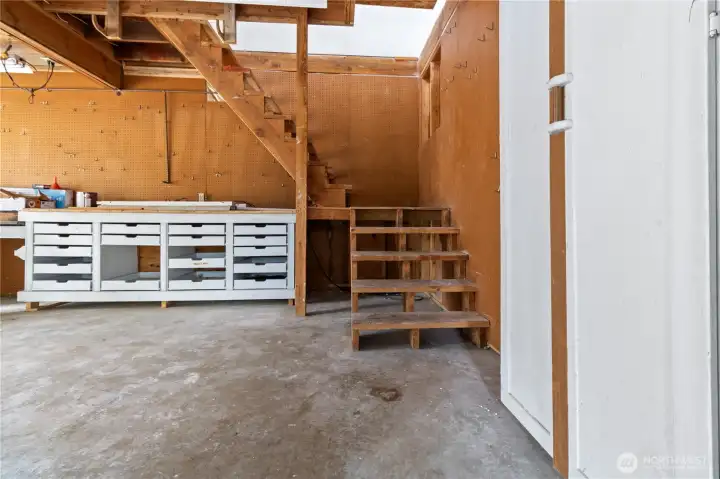 Built in shop area, stairs lead to upstairs bonus space.