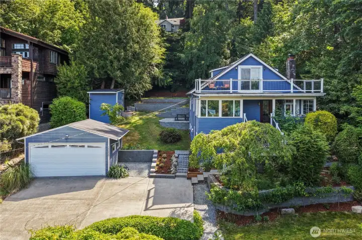 Expansive outdoor spaces featuring garden beds, espaliered fruit trees, patio entertaining areas, and beautifully maintained grounds.