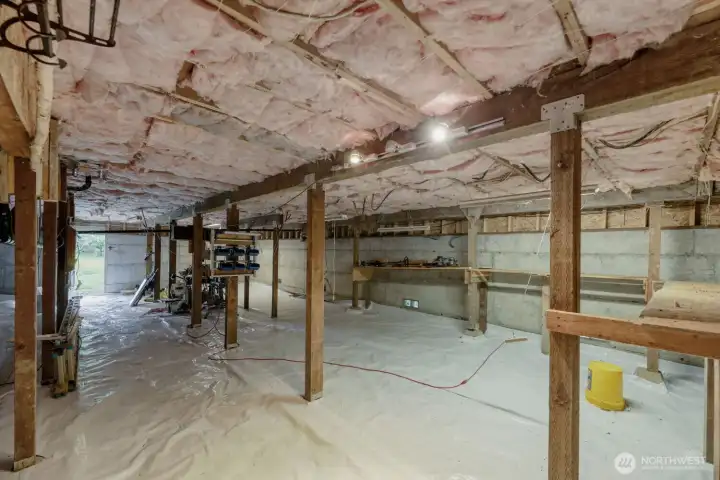 Unfinished Basement currently used as a Shop.
