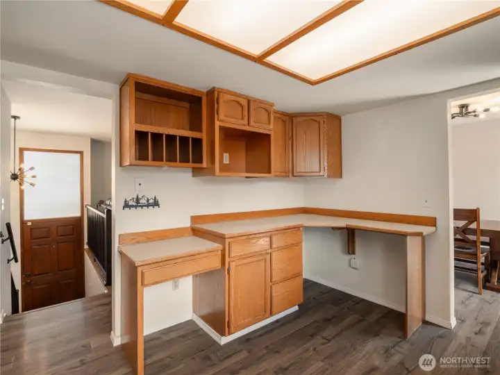 The well-appointed kitchen includes built in desk and organizer spaces. The well-appointed kitchen includes built in desk and organizer spaces.