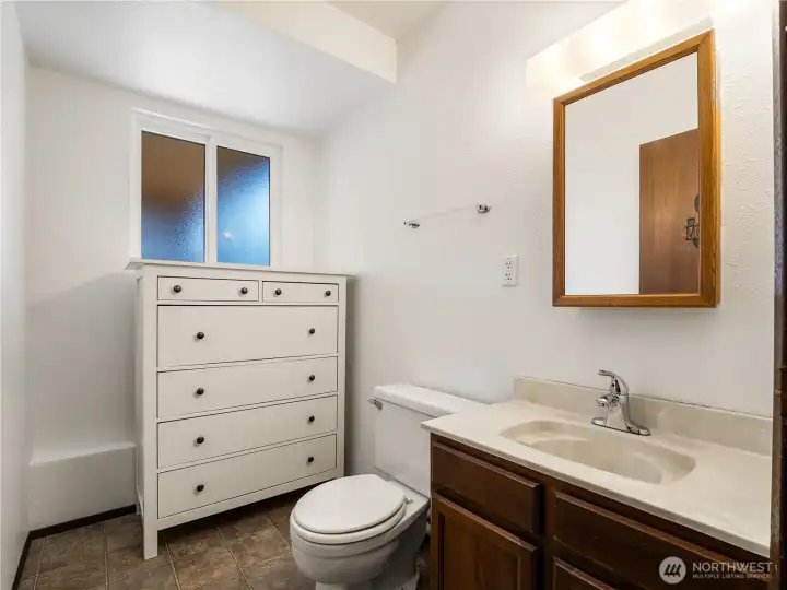 This lower level powder room is plumbed and ready for a tub or shower. This lower level powder room is plumbed and ready for a tub or shower.