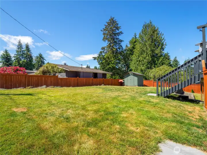 The large yard is wide open for play, recreation, or your favorite flower or vegetable garden. There is no shortage of sunlight in this space! The large yard is wide open for play, recreation, or your favorite flower or vegetable garden. There is no shortage of sunlight in this space!