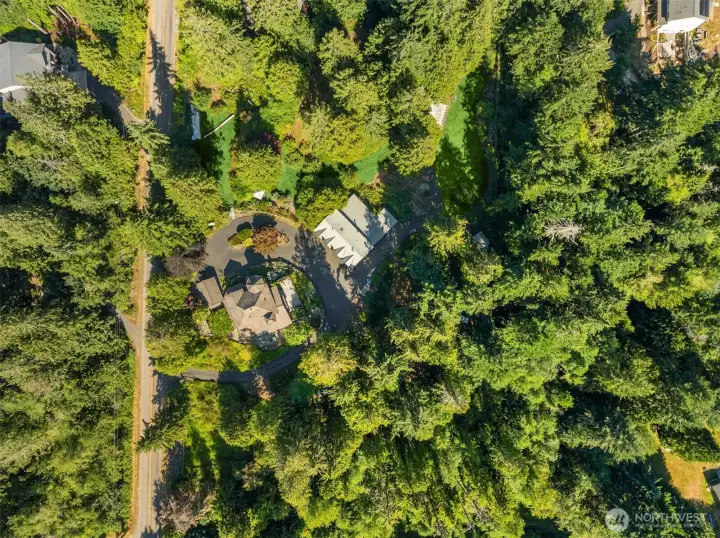 Aerial view capturing the entire property and all buildings. Aerial view capturing the entire property and all buildings.
