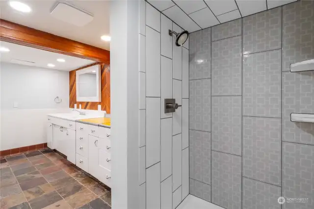Bathroom downstairs with custom tile in the walk in shower