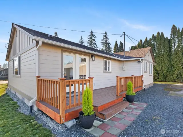 The attractive deck opens to the rear entry of the home.