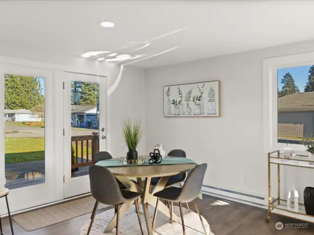 The pleasant dining room. This home has large windows and welcome natural light throughout.