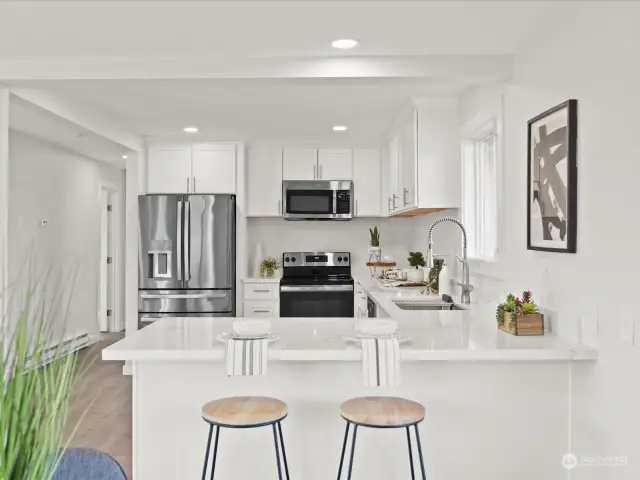 You'll never feel isolated with this floor plan. The breakfast bar is the perfect spot to sit and visit with the cook.