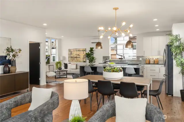 Looking towards the kitchen and dining areas. The door to the left opens up to an immense pantry conveniently located.