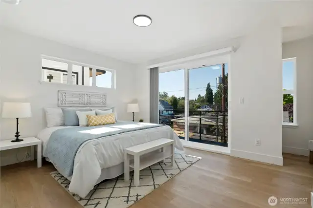 Relish the spacious primary bedroom with a balcony.