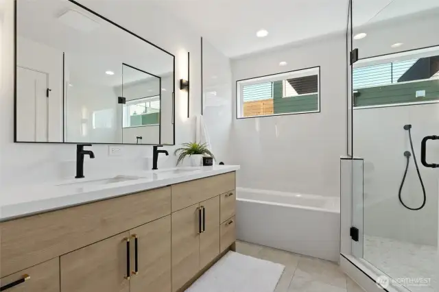 Discover the perfect blend of luxury and functionality in the primary bath, featuring a roomy shower, elegant tub, and double vanity.