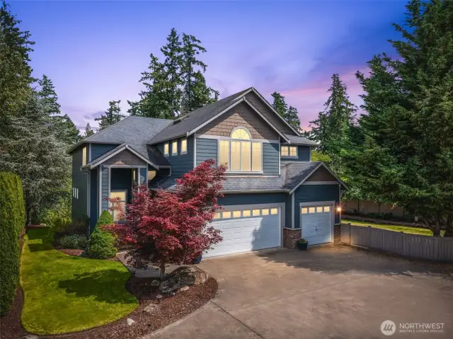 Twilight ambiance showcases the serene setting and welcoming exterior lighting.