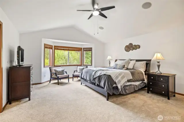 Spacious and sun-filled, this primary suite is the perfect place to unwind and recharge.
