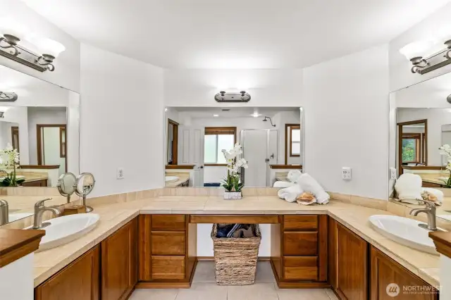 Abundant light, dual vanities, and a spacious layout create a relaxing retreat.