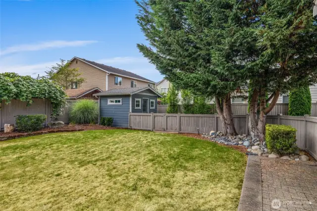 Imagine weekend cookouts, games, and quality time on this beautifully maintained paver patio and green backyard.